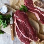 sliced meat on the wooden chopping board